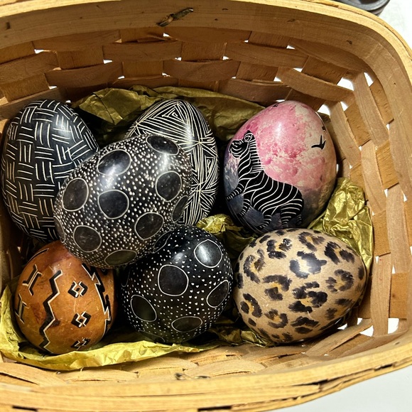 7 hand painted stone eggs in a basket . - Picture 1 of 9